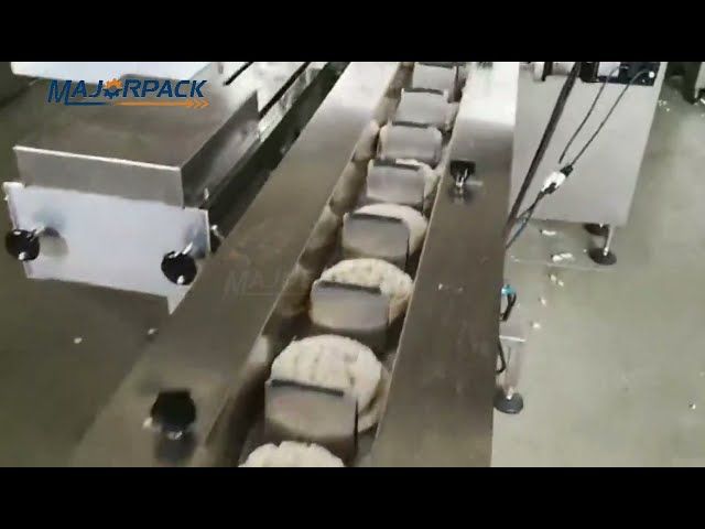 Full automatic round rice cake packing machine line with turning dish.